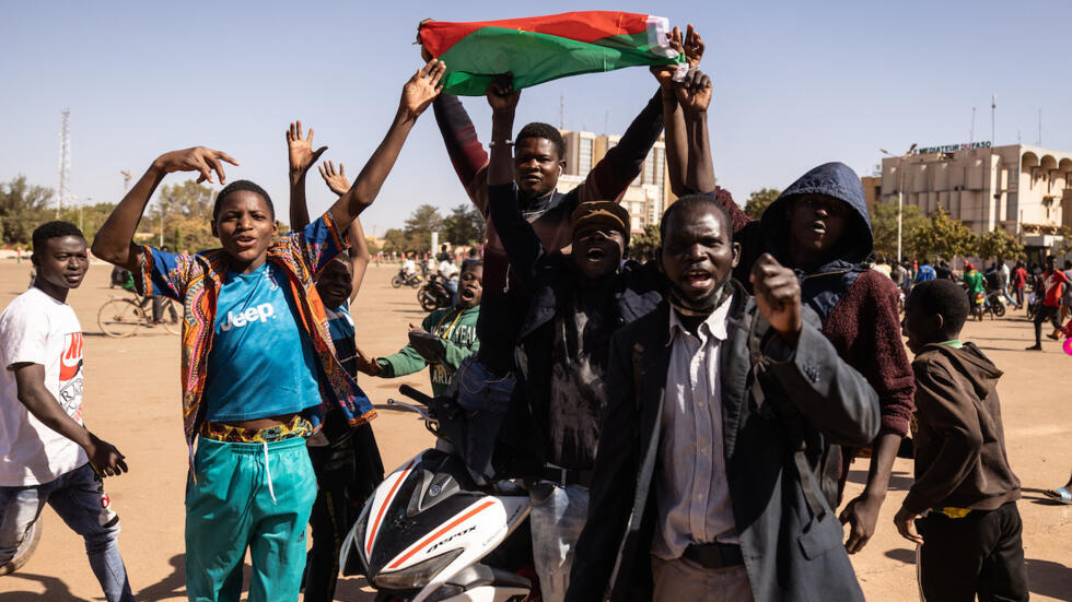 Shots heard near Burkina Faso president's home, protesters torch ruling